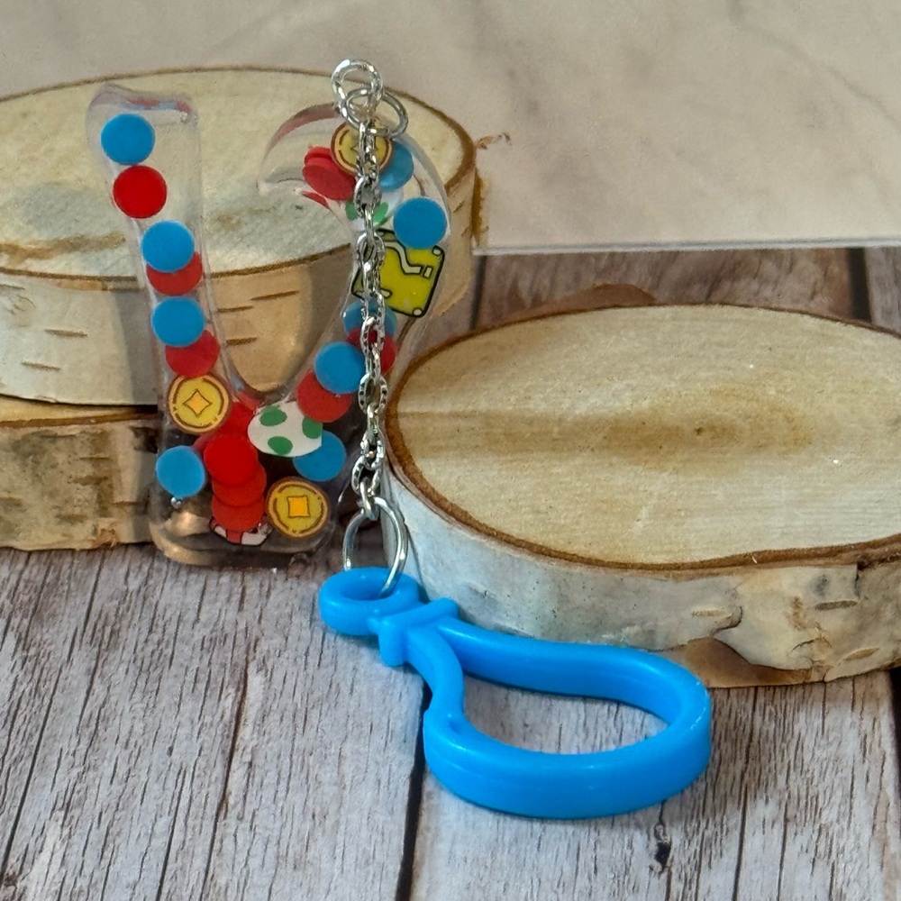 Letter V with video game inspired charms newly made.